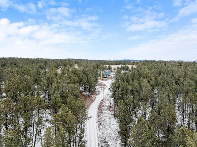 aerial view featuring a view of trees