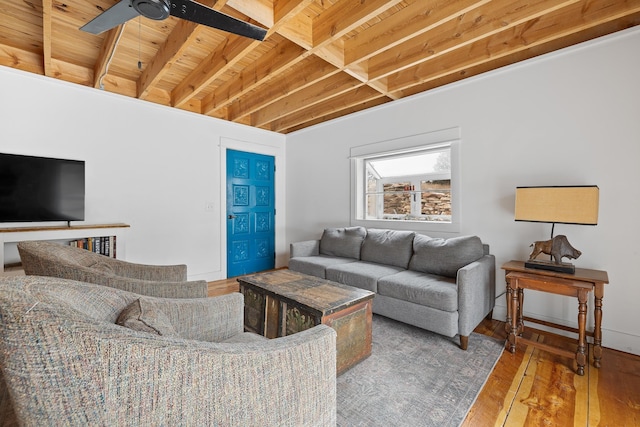 living room featuring hardwood / wood-style floors and a ceiling fan