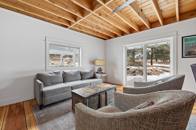 living area featuring hardwood / wood-style flooring and baseboards