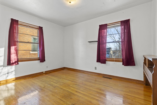 unfurnished room featuring light wood-type flooring