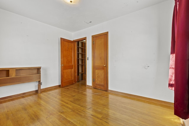 spare room with wood-type flooring