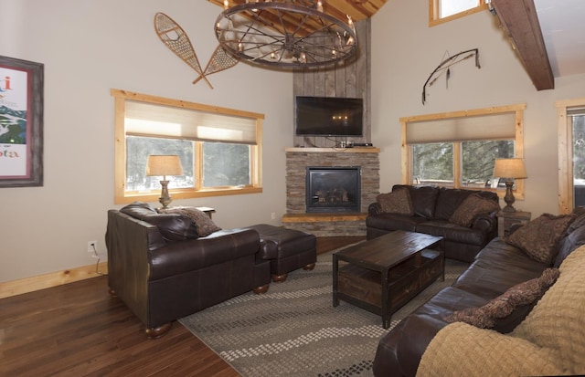 living room featuring a fireplace, dark hardwood / wood-style flooring, lofted ceiling with beams, and a notable chandelier