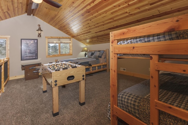 playroom with lofted ceiling with beams, ceiling fan, wooden ceiling, and dark carpet