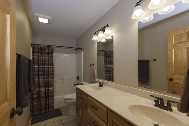 full bathroom with tile patterned flooring, shower / tub combo, vanity, and toilet