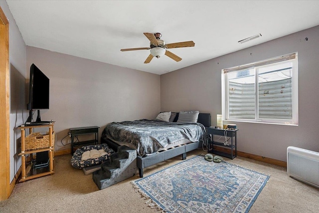 bedroom with ceiling fan and light colored carpet