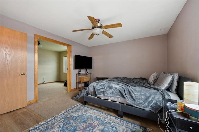 bedroom featuring ceiling fan and light hardwood / wood-style floors