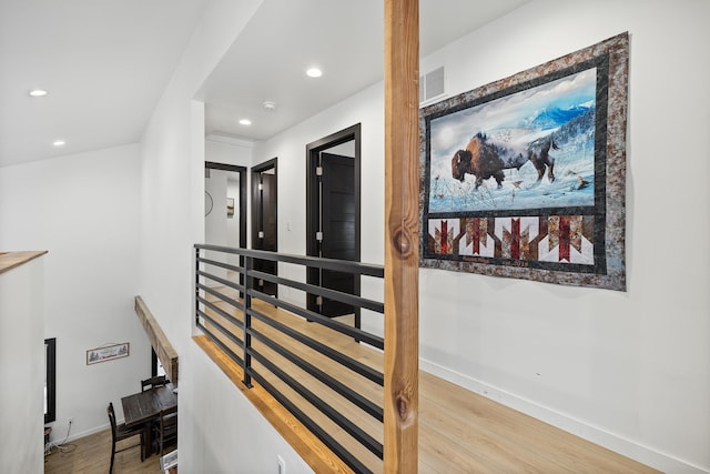 hall with light hardwood / wood-style flooring