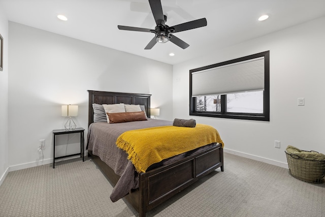 bedroom with ceiling fan and light carpet