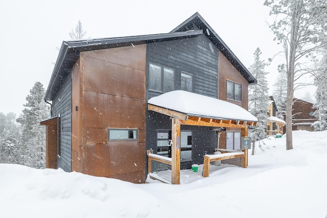 view of snow covered property