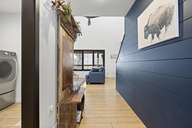 corridor featuring light hardwood / wood-style flooring and washer / clothes dryer