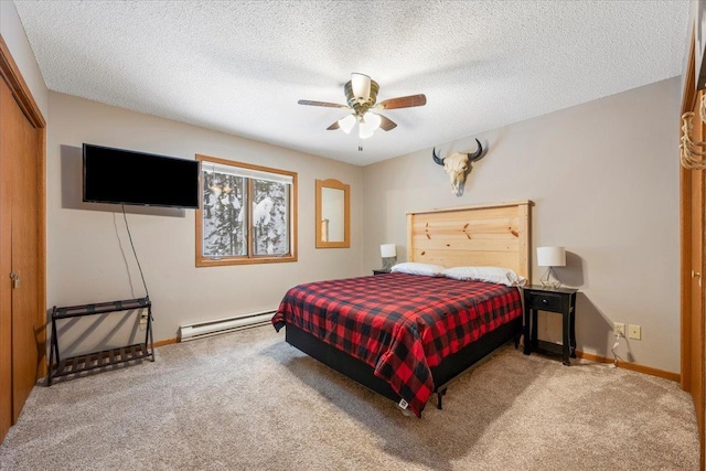 bedroom with a textured ceiling, light carpet, ceiling fan, a closet, and a baseboard radiator