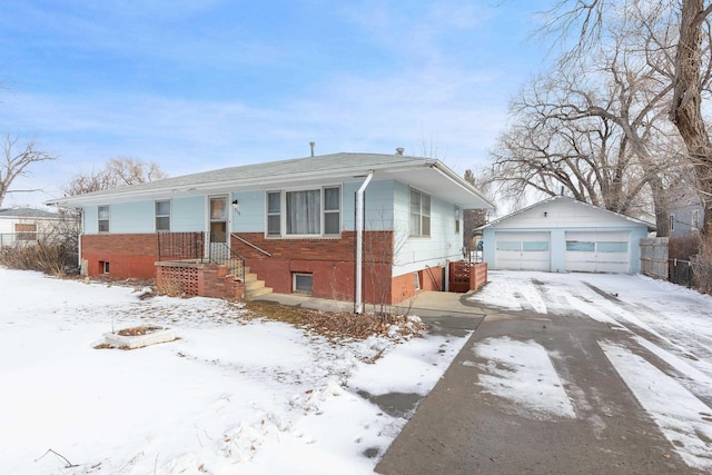 view of front of home featuring a garage and an outdoor structure