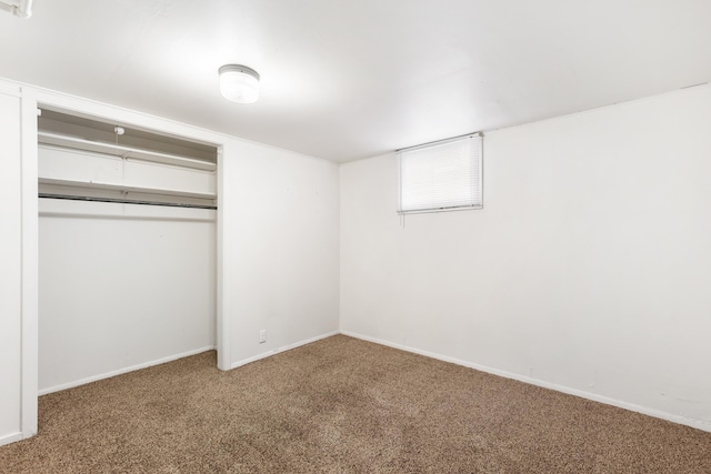 unfurnished bedroom with a closet and carpet floors