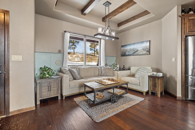 living room with dark hardwood / wood-style flooring and a notable chandelier