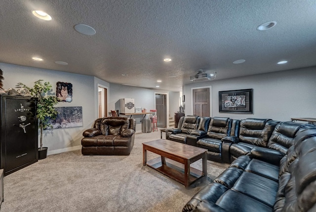 carpeted cinema featuring a textured ceiling