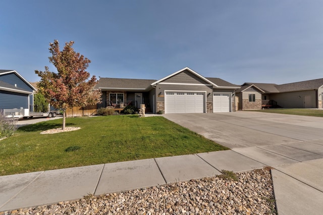 single story home with a garage and a front yard