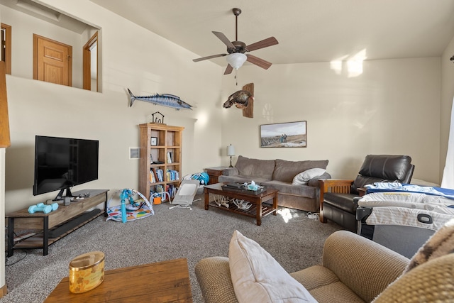 carpeted living room with ceiling fan and lofted ceiling