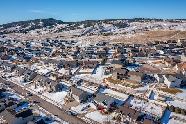 snowy aerial view with a mountain view