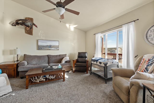 carpeted living room with ceiling fan