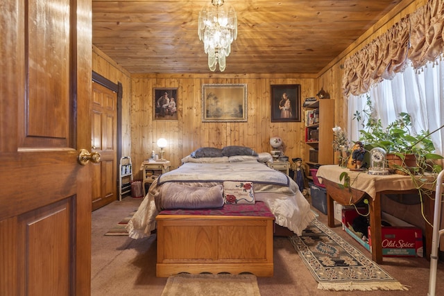 carpeted bedroom with a notable chandelier, wood ceiling, and wooden walls