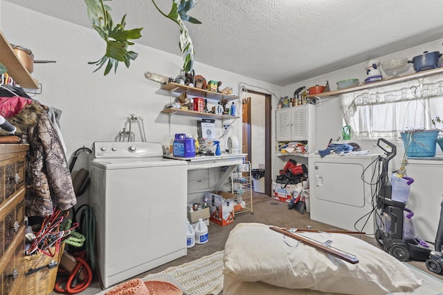 washroom with a textured ceiling, carpet flooring, and washing machine and clothes dryer