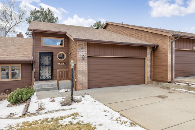 ranch-style house featuring a garage