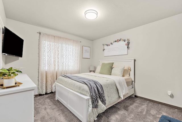 bedroom featuring dark carpet