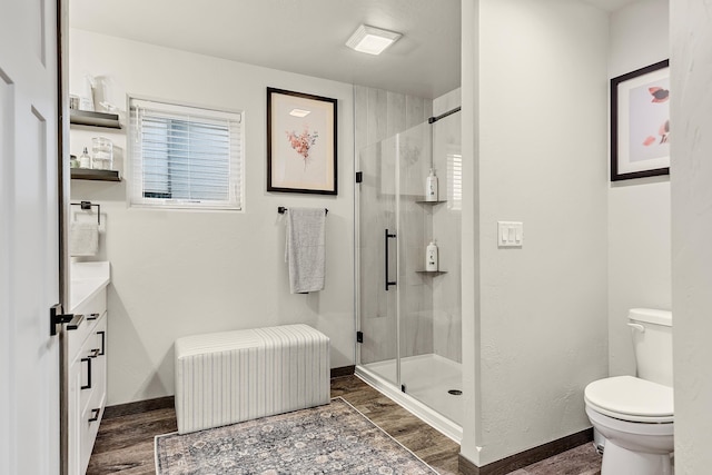 bathroom featuring toilet, a shower with door, and radiator heating unit