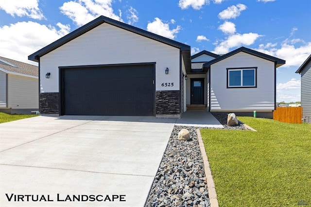 view of front facade featuring a front lawn and a garage