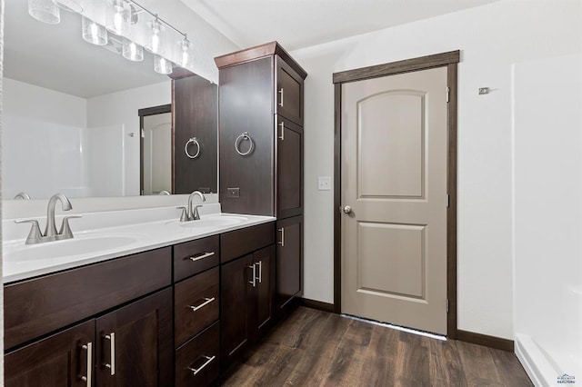 bathroom featuring hardwood / wood-style floors and vanity