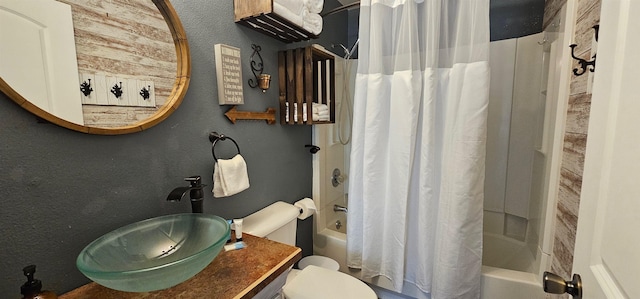 full bathroom with sink, toilet, and shower / tub combo with curtain