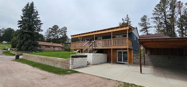 view of front facade with a patio area, a deck, and a front lawn