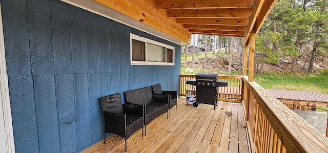 wooden deck featuring grilling area