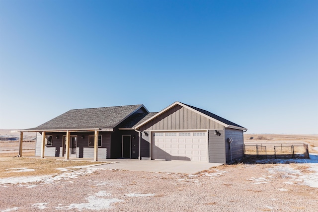 view of front facade with covered porch and a garage