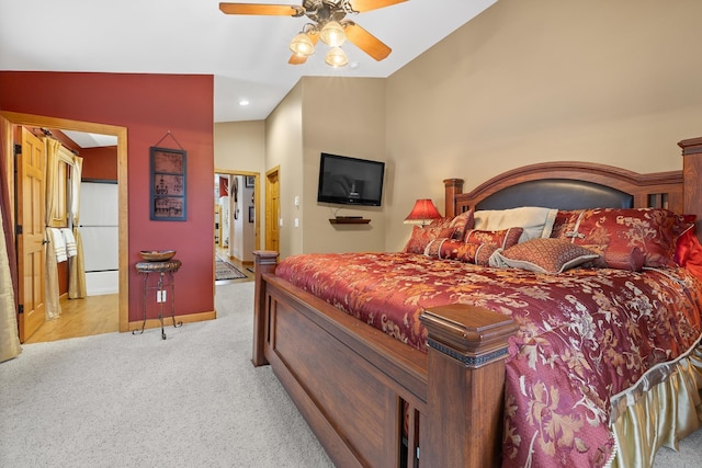 carpeted bedroom featuring ceiling fan and vaulted ceiling