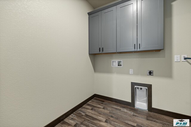 laundry room with electric dryer hookup, cabinets, washer hookup, and dark hardwood / wood-style floors