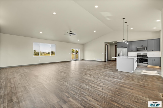 unfurnished living room with ceiling fan, high vaulted ceiling, and hardwood / wood-style floors