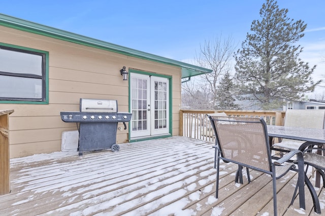 wooden terrace featuring area for grilling and french doors