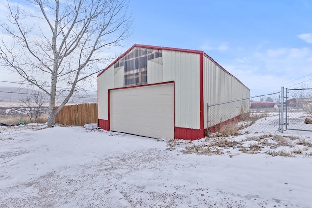 view of snow covered garage