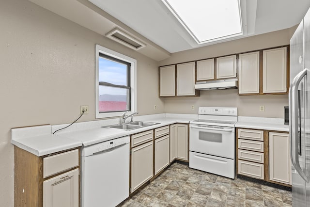 kitchen featuring sink and white appliances