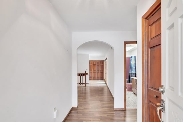 hall with hardwood / wood-style floors