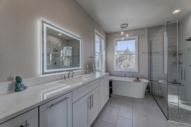 bathroom featuring vanity, tile patterned floors, and plus walk in shower