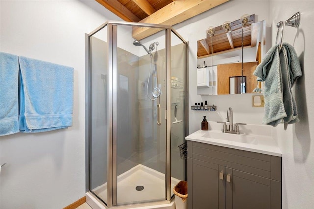 bathroom featuring beam ceiling, an enclosed shower, wood ceiling, and vanity