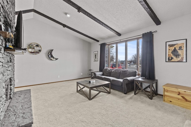 carpeted living room featuring a stone fireplace, lofted ceiling with beams, and a textured ceiling