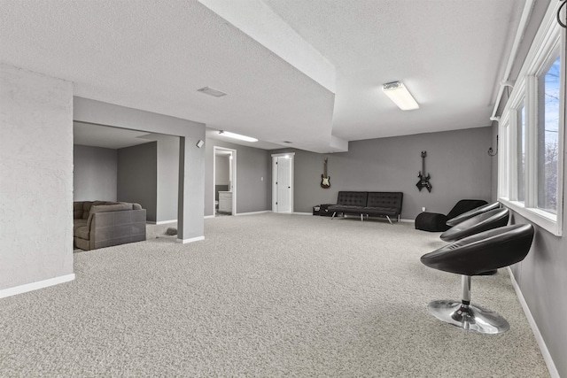 interior space featuring carpet floors and a textured ceiling