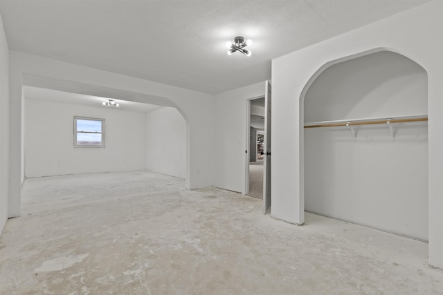 interior space featuring a closet and a textured ceiling