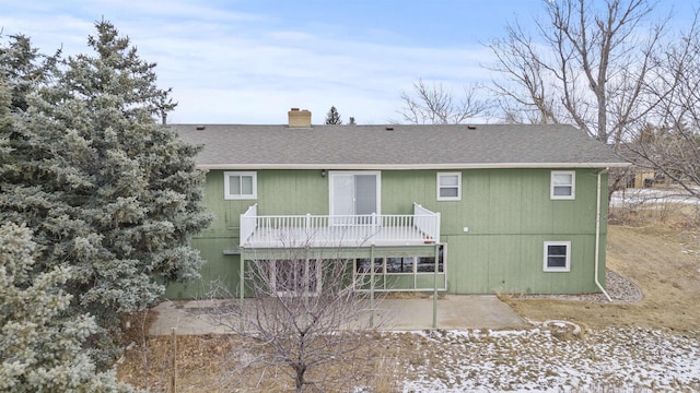 rear view of house with a patio and a deck