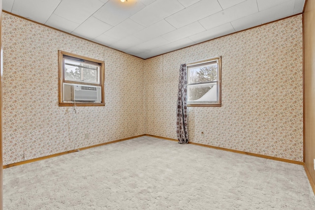 carpeted spare room with cooling unit