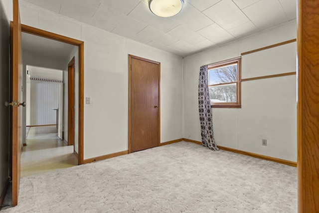 unfurnished bedroom featuring light colored carpet