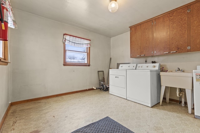 washroom with cabinets and independent washer and dryer